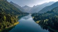 Scenic alpine lake surrounded by lush green mountains and forests Royalty Free Stock Photo