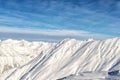 Scenic austrian alpine mountain peaks covered with snow layer in winter at bright sunny day. Blue clear sky on background. Natural Royalty Free Stock Photo