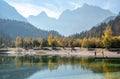 Scenic autumn forest at Crystal Lake in the Julian Alps in Slovenia Royalty Free Stock Photo