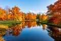 Scenic autumn landscape reflected in water in Alexander park, Pushkin Tsarskoe Selo, Saint Petersburg, Russia