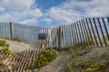 Wind Fence and Warning Sign on Florida Sand Dune Royalty Free Stock Photo