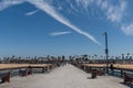 Scenic Balboa Pier vista on a beautiful summer day with people walking and fishing, Newport Beach, Orange County, California