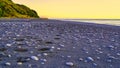 Scenic beach with unique white pebbles at sunset Royalty Free Stock Photo
