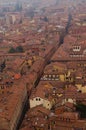 Scenic bird-eye view from the top of the tower on Bologna old town center. Vintage buildings with red tile roofs Royalty Free Stock Photo