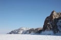 Scenic blue clear transparent ice Lake Baikal. Smooth surface deep cracks. Tourists people walk travel. Cinematic High mountains Royalty Free Stock Photo