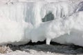 Scenic blue clear transparent ice Lake Baikal. Smooth surface deep cracks. Tourists people walk travel. Cinematic High mountains Royalty Free Stock Photo