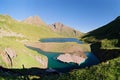 Scenic blue sky summer landscape of Chilik mountain lake with mountain peaks on background on Abishira-Akhuba Ridge in Caucasus