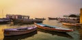 Scenic boats close to the banks of Ganga river on misty morning, Varanasi, India