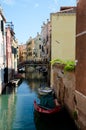 Scenic bridge over small canal in Venice