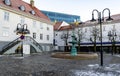 A scenic bronze fountain in a small square in front of Stavanger Chamber of Commerce