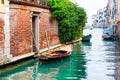 Scenic canal with boats in Venice, Italy