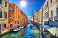 Scenic canal with Carabinieri boats, Venice, Italy, HDR