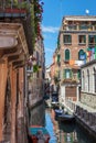 Scenic canal with colorful ancient houses, Venice, Italy