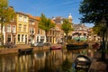 Scenic cityscape of Leiden with townhouses and embankments along canal