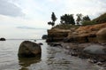 Scenic cliff with sundstone layers. the boulders on shore of Baltic sea. Summer storm time.