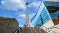 Scenic CN Tower overlooking Ontario Lake. A panoramic view from the base of the tower to the top observation deck and Royalty Free Stock Photo