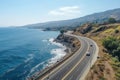 Scenic coastal drive with cars on asphalt road, stunning ocean view from top drone perspective
