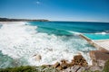 Scenic coastline with blue sky and sun