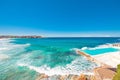 Scenic coastline with blue sky and sun