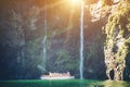 Scenic cruise approaches waterfall, Milford Sound. Royalty Free Stock Photo