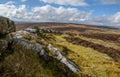 Scenic Dartmoor, a long winding granite wall on a bright spring day, views sweeping out to the horizon