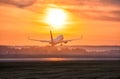 Scenic dawn with a fog at the airport. Takeoff of a passenger airplane Royalty Free Stock Photo