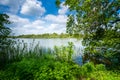 Scenic delight English countryside park. View across the lake inside the beautiful Fairfield Garden in Norfolk, England. Travel Royalty Free Stock Photo