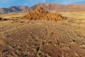 Desert landscape with rocks and arid grassland, Brandberg mountain, Namibia Royalty Free Stock Photo