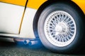 Scenic detail of smoke out from exhaust system of an old racing car in a famous italian historical race Royalty Free Stock Photo