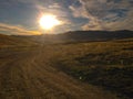 Scenic dirt road during sunset, near Queenstown, New Zealand Royalty Free Stock Photo