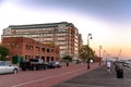 Scenic display of Flagship Wharf Condos in Charlestown navy yard, street in Boston at sunset