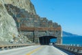 Scenic drive on Bridge and Rock Shed at Pitkins Curve and Rain Rocks along rugged coastline of Big Sur with Santa Lucia Mountains