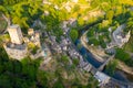Drone view of Belcastel village overlooking fortified castle, France Royalty Free Stock Photo