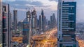 Scenic Dubai downtown architecture day to night timelapse. Top view over Sheikh Zayed road with illuminated skyscrapers Royalty Free Stock Photo