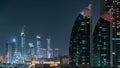 Scenic Dubai downtown architecture at night timelapse. Aerial view of numerous skyscrapers near Sheikh Zayed road.