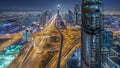 Scenic Dubai downtown skyline at night . Rooftop view of Sheikh Zayed road with numerous illuminated towers.