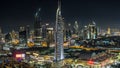 Scenic Dubai downtown skyline timelapse at night. Rooftop view of Sheikh Zayed road with numerous illuminated towers. Royalty Free Stock Photo