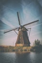 Scenic dutch rural landscape with traditional mill, Netherlands, vintage
