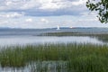 Scenic Eastern Canada river with sailboat in background