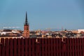 Scenic evening panorama of the Old Town of Stockholm city from behind a red fence Royalty Free Stock Photo