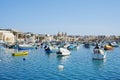 Scenic fishing boats in european Marsaxlokk town in Malta