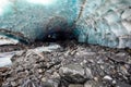 Scenic glacier ice caves with river flowing out from inside Royalty Free Stock Photo