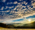 Scenic glorious winter sunrise with a panoramic view over a snowy idyllic countryside Royalty Free Stock Photo