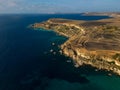Scenic golden rocky cliffs in Malta aerial near famous Golden Bay Beach Royalty Free Stock Photo