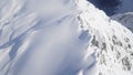 Scenic Helicopter ride over the Franz Josef Glacier and Fox Glacier with deep crevasses and snow during winter in New Zealand.