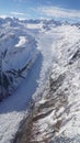 Scenic Helicopter ride over the Franz Josef Glacier and Fox Glacier with deep crevasses and snow during winter in New Zealand.