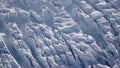 Scenic Helicopter ride over the Franz Josef Glacier and Fox Glacier with deep crevasses and snow during winter in New Zealand.