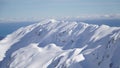 Scenic Helicopter ride over the Franz Josef Glacier and Fox Glacier with deep crevasses and snow during winter in New Zealand.