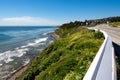 Scenic high angle horizontal shot of the ocean and a rocky beach on the road in San Pedro, California