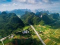 Scenic highway in Guangxi province of China surrounded with rice fields and rocks Royalty Free Stock Photo